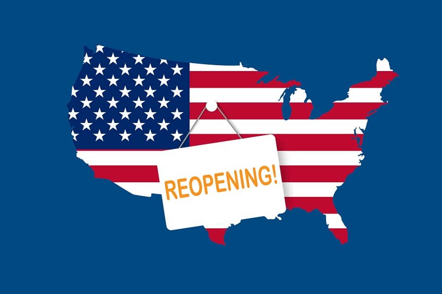 reopening sign hanging on image of United States