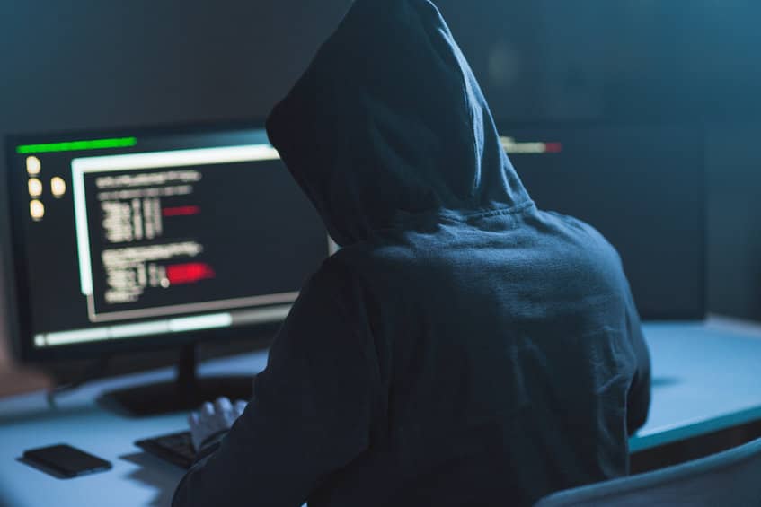 cyber criminal hacking into computer