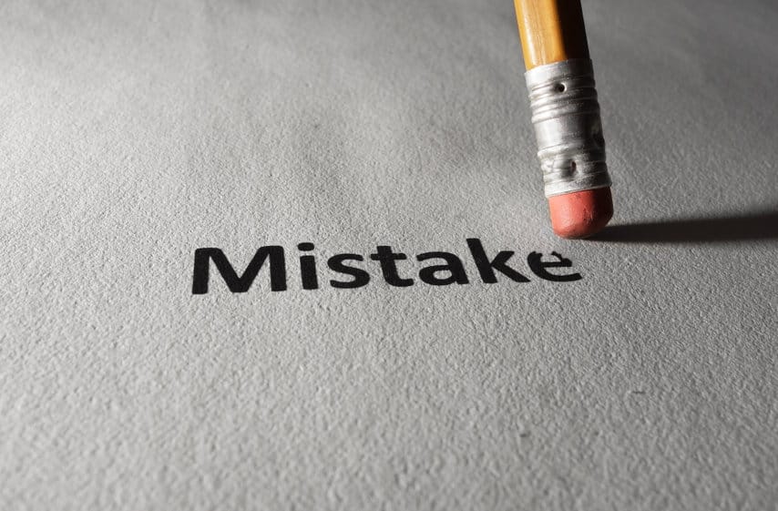 eraser erasing the word "mistake"